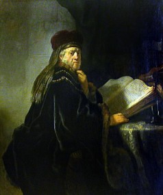 A Scholar Seated at a Table with Books