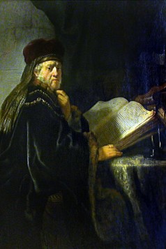 A Scholar Seated at a Table with Books