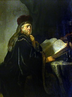 A Scholar Seated at a Table with Books