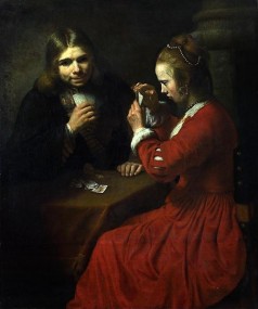 A Young Man and a Girl playing Cards